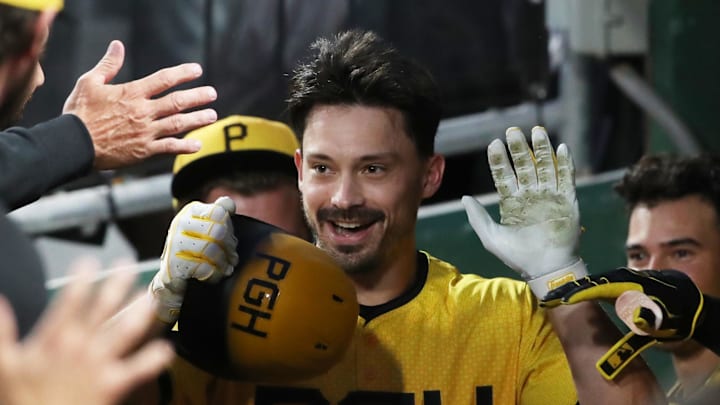Jun 6, 2025; Pittsburgh, Pennsylvania, USA;  Pittsburgh Pirates right fielder Bryan Reynolds (10) celebrates his  solo home run in the dugout against the Philadelphia Phillies during the third inning at PNC Park. Mandatory Credit: Charles LeClaire-Imagn Images