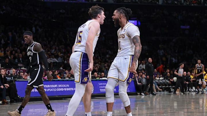 Mar 31, 2024; Brooklyn, New York, USA; Los Angeles Lakers guard Austin Reaves (15) and guard D'Angelo Russell (1) react after a basket during the second half against the Brooklyn Nets at Barclays Center. Mandatory Credit: Vincent Carchietta-Imagn Images Mar 31, 2024; Brooklyn, New York, USA; Los Angeles Lakers guard Austin Reaves (15) and guard D'Angelo Russell (1) react after a basket during the second half against the Brooklyn Nets at Barclays Center. Mandatory Credit: Vincent Carchietta-Imagn Images
