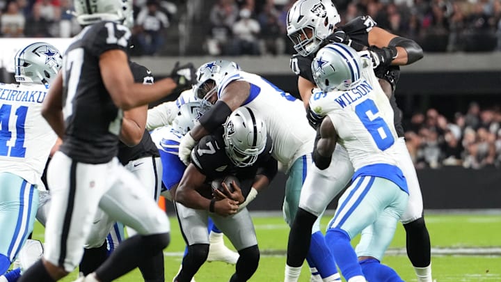 Nov 17, 2025; Paradise, Nevada, USA; Las Vegas Raiders quarterback Geno Smith (7) is sacked by Dallas Cowboys defensive tackle Kenny Clark (95) and defensive tackle Quinnen Williams (92) during the first half at Allegiant Stadium. Mandatory Credit: Stephen R. Sylvanie-Imagn Images Nov 17, 2025; Paradise, Nevada, USA; Las Vegas Raiders quarterback Geno Smith (7) is sacked by Dallas Cowboys defensive tackle Kenny Clark (95) and defensive tackle Quinnen Williams (92) during the first half at Allegiant Stadium. Mandatory Credit: Stephen R. Sylvanie-Imagn Images
