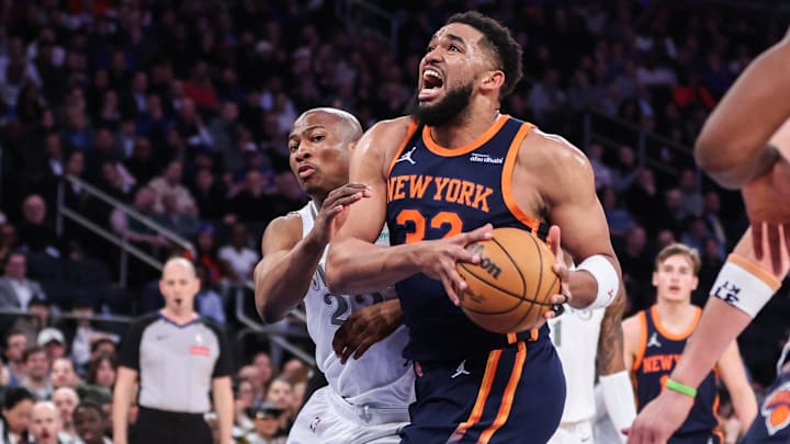 Mar 25, 2025; New York, New York, USA;  New York Knicks center Karl-Anthony Towns (32) drives past Dallas Mavericks forward Kai Jones (23) in the first quarter at Madison Square Garden. Mandatory Credit: Wendell Cruz-Imagn Images