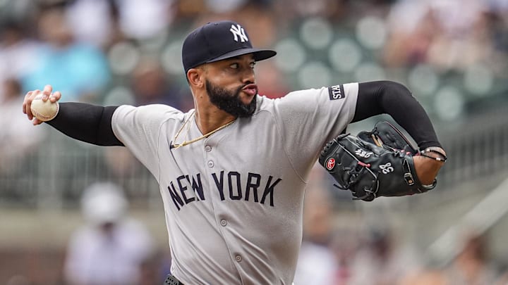 Jul 20, 2025; Cumberland, Georgia, USA; New York Yankees relief pitcher Devin Williams (38) pitches against the Atlanta Braves during the ninth inning at Truist Park. Mandatory Credit: Dale Zanine-Imagn Images