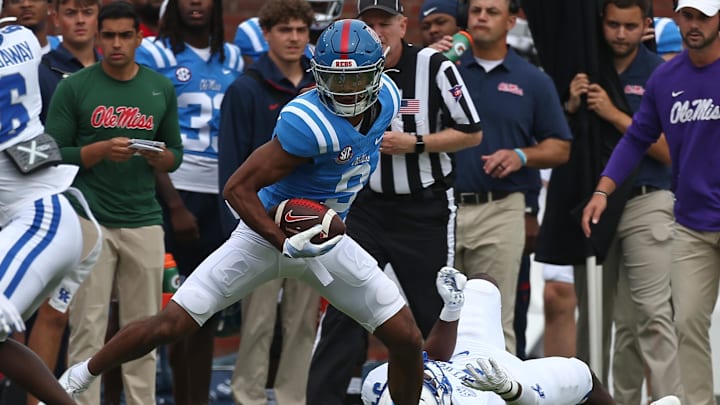 Sep 28, 2024; Oxford, Mississippi, USA; Mississippi Rebels wide receiver Tre Harris (9) breaks a tackle attempt by Kentucky Wildcats linebacker D’Eryk Jackson (54) during the first half at Vaught-Hemingway Stadium. Mandatory Credit: Petre Thomas-Imagn Images Sep 28, 2024; Oxford, Mississippi, USA; Mississippi Rebels wide receiver Tre Harris (9) breaks a tackle attempt by Kentucky Wildcats linebacker D’Eryk Jackson (54) during the first half at Vaught-Hemingway Stadium. Mandatory Credit: Petre Thomas-Imagn Images