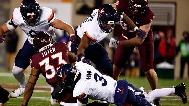 Virginia brings down Virginia Tech running back Bhayshul Tuten at Lane Stadium, Nov. 30, 2024. Virginia brings down Virginia Tech running back Bhayshul Tuten at Lane Stadium, Nov. 30, 2024.