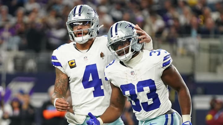 Dec 14, 2025; Arlington, Texas, USA; Dallas Cowboys running back Javonte Williams (33) celebrates with quarterback Dak Prescott (4) after a touchdown during the first half against the Minnesota Vikings at AT&T Stadium. 