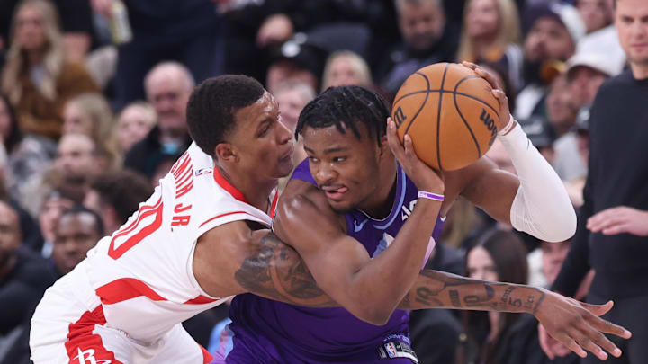 Feb 22, 2025; Salt Lake City, Utah, USA; Houston Rockets forward Jabari Smith Jr. (10) reaches for the ball held by Utah Jazz guard Isaiah Collier (13) during the second half at Delta Center. Mandatory Credit: Rob Gray-Imagn Images