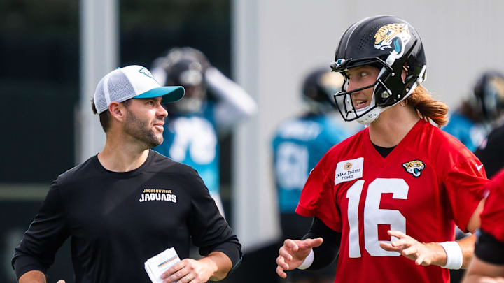 Jacksonville Jaguars quarterbacks coach Spencer Whipple, left, jogs with quarterback Trevor Lawrence (16) to the next drill during the Jacksonville Jaguars’ mandatory minicamp Tuesday June 10, 2025 at the Miller Electric Center in Jacksonville, Fla.