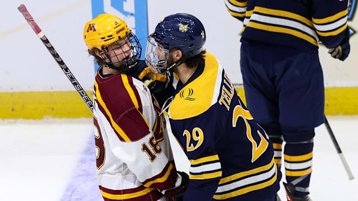 Apr 8, 2023; Tampa, Florida, USA; Quinnipiac forward Cristophe Tellier (29) and Minnesota forward Mason Nevers (18) exchange words during a break in play in the second period during the national championship game of the 2023 Frozen Four college ice hockey tournament at Amalie Arena. Mandatory Credit: Nathan Ray Seebeck-Imagn Images Apr 8, 2023; Tampa, Florida, USA; Quinnipiac forward Cristophe Tellier (29) and Minnesota forward Mason Nevers (18) exchange words during a break in play in the second period during the national championship game of the 2023 Frozen Four college ice hockey tournament at Amalie Arena. Mandatory Credit: Nathan Ray Seebeck-Imagn Images