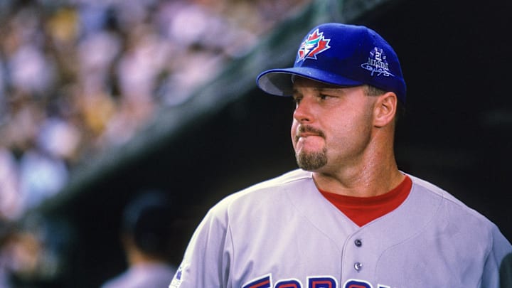 American League pitcher Roger Clemens (21) of the Toronto Blue Jays looks on from the dugout against the National League during the 1998 MLB All-Star Game at Coors Field. American League pitcher Roger Clemens (21) of the Toronto Blue Jays looks on from the dugout against the National League during the 1998 MLB All-Star Game at Coors Field.