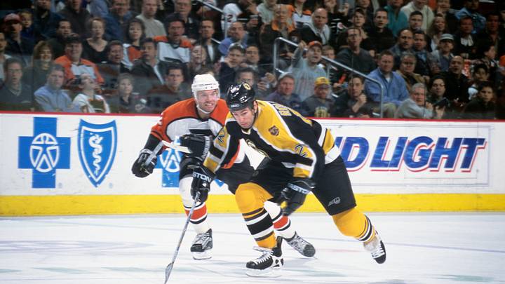 Apr 2, 2002; Philadelphia, PA, USA; FILE PHOTO; Boston Bruins center Brian Rolston (12) on the ice against Philadelphia Flyers defenseman Eric Weinrich (2) at First Union Center. Mandatory Credit: Lou Capozzola-USA TODAY NETWORK