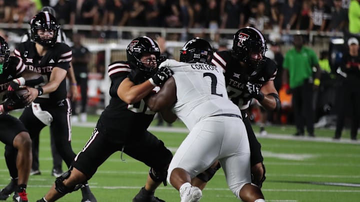 Sep 28, 2024; Lubbock, Texas, USA;  Texas Tech Red Raiders offensive lineman Davion Carter (56) blocks Cincinnati Bearcats defensive tackle Dontay Corleone (2) in the first half at Jones AT&T Stadium and Cody Campbell Field. Mandatory Credit: Michael C. Johnson-Imagn Images