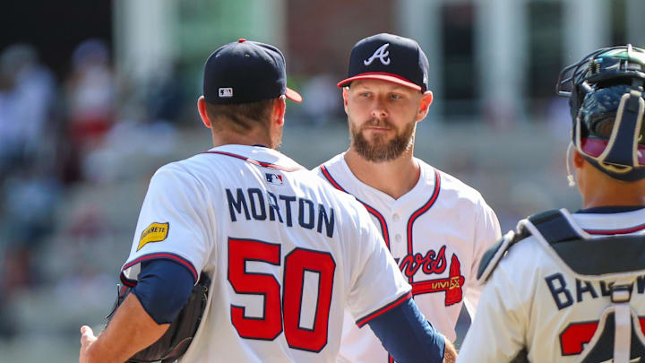 Sep 28, 2025; Cumberland, Georgia, USA; Atlanta Braves pitcher Charlie Morton (50) shakes hands with teammate pitcher Chris Sale (51) after pitching against the Pittsburgh Pirates during the second inning at Truist Park. Mandatory Credit: Jordan Godfree-Imagn Images