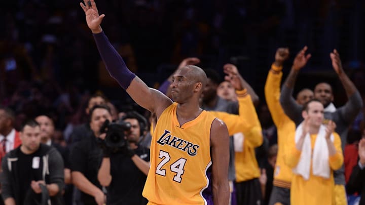 Apr 13, 2016; Los Angeles, CA, USA; Los Angeles Lakers guard Kobe Bryant (24) waves to the Staples Center crowd as he leaves the game against the Utah Jazz in the closing seconds. Bryant scored 60 points in the final game of his career. Mandatory Credit: Robert Hanashiro-Imagn Images