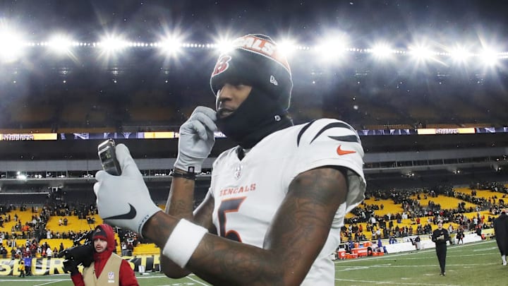 Jan 4, 2025; Pittsburgh, Pennsylvania, USA;  Cincinnati Bengals wide receiver Tee Higgins (5) goes live on social media after defeating the Pittsburgh Steelers at Acrisure Stadium. Mandatory Credit: Charles LeClaire-Imagn Images