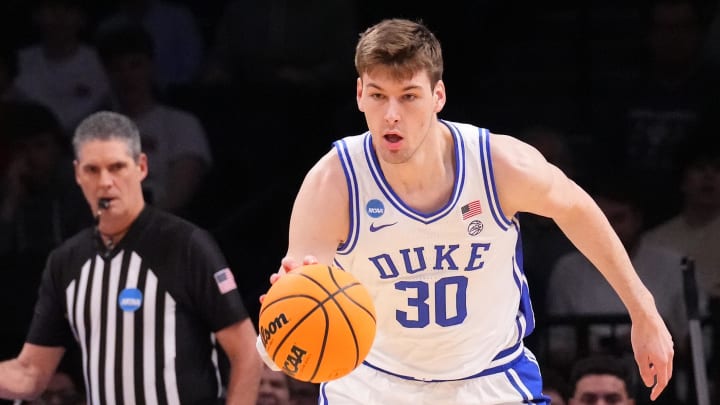 Mar 24, 2024; Brooklyn, NY, USA; Duke Blue Devils center Kyle Filipowski (30) dribbles the ball against the James Madison Dukes in the second round of the 2024 NCAA Tournament  at Barclays Center. Mandatory Credit: Robert Deutsch-USA TODAY Sports