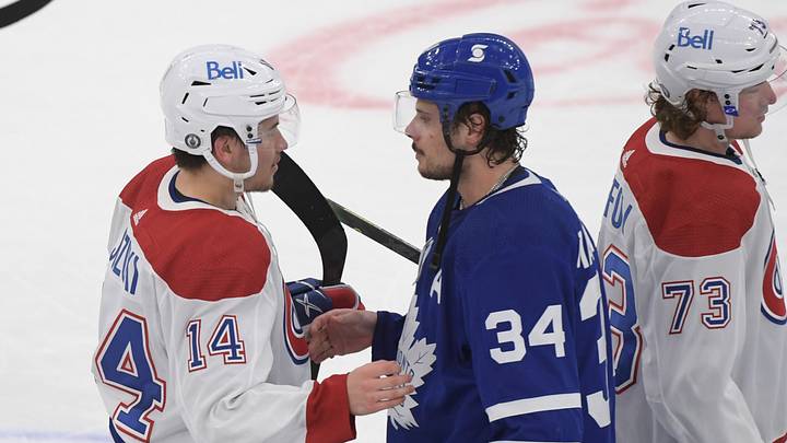 May 31, 2021; Toronto, Ontario, CAN; Toronto Maple Leafs forward Auston Matthews (34) congratulates Montreal Canadiens forward Nick Suzuki (14) after the Canadiens beat the Leafs 3-1 in game seven of the first round of the 2021 Stanley Cup Playoffs at Scotiabank Arena. Mandatory Credit: Dan Hamilton-USA TODAY Sports