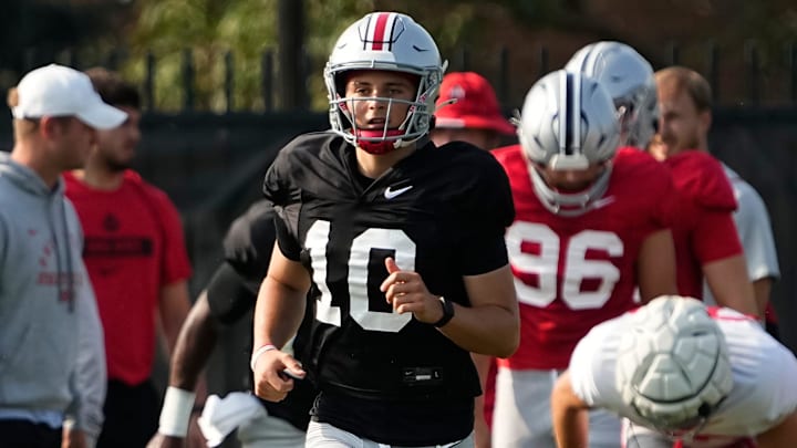 Aug 8, 2024; Columbus, Ohio, USA; Ohio State Buckeyes quarterback Julian Sayin (10) runs during football practice at the Woody Hayes Athletic Complex.