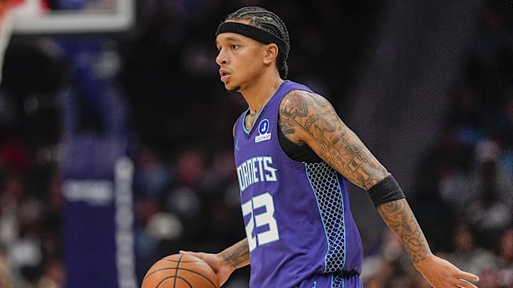 Nov 2, 2025; Charlotte, North Carolina, USA; Charlotte Hornets guard Tre Mann (23) handles the ball against the Utah Jazz during the first quarter at Spectrum Center. Mandatory Credit: Jim Dedmon-Imagn Images