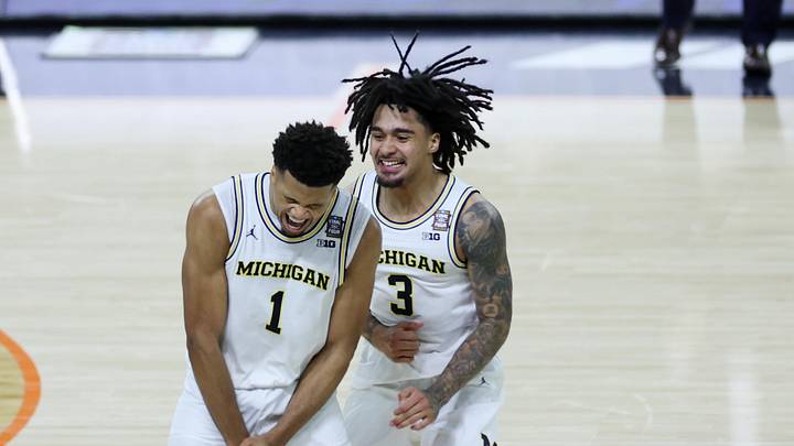 Apr 6, 2026; Indianapolis, IN, USA; Michigan Wolverines guard Trey McKenney (1) and Michigan Wolverines guard Elliot Cadeau (3) celebrate after a play against the UConn Huskies in the second half during the national championship of the Final Four of the men's 2026 NCAA Tournament at Lucas Oil Stadium. Mandatory Credit: Trevor Ruszkowski-Imagn Images