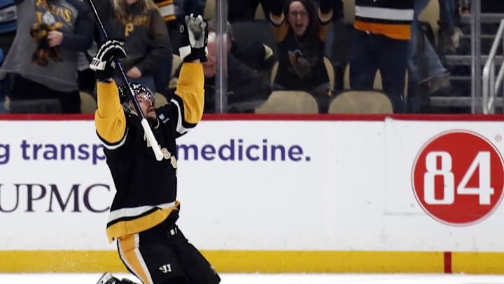 Apr 11, 2024; Pittsburgh, Pennsylvania, USA; Pittsburgh Penguins defenseman Erik Karlsson (65) reacts after scoring the game winning goal against the Detroit Red Wings in overtime at PPG Paints Arena. Pittsburgh won 6-5 in overtime. Mandatory Credit: Charles LeClaire-Imagn Images