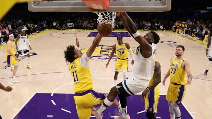 Apr 22, 2025; Los Angeles, California, USA; Minnesota Timberwolves guard Anthony Edwards (5) dunks the ball against Los Angeles Lakers center Jaxson Hayes (11) during the second half of game two of first round for the 2024 NBA Playoffs at Crypto.com Arena. Mandatory Credit: Kiyoshi Mio-Imagn Images