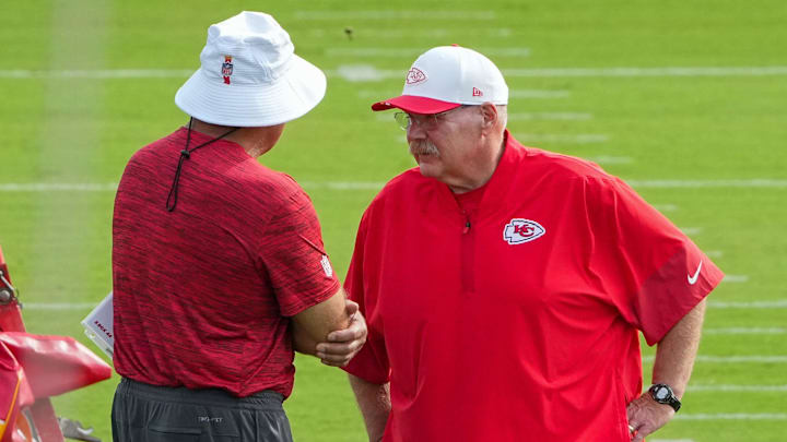 Jul 22, 2025; St. Joseph, MO, USA; Kansas City Chiefs head coach Andy Reid speaks with a staff member on field during training camp at Missouri Western State University. Mandatory Credit: Denny Medley-Imagn Images