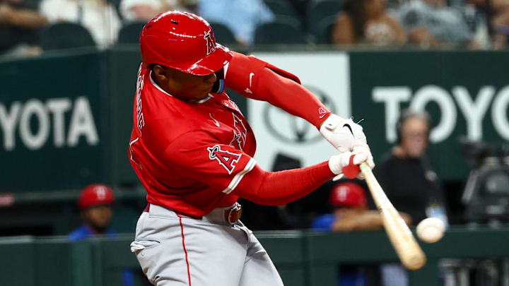 Aug 27, 2025; Arlington, Texas, USA;  Los Angeles Angels second baseman Christian Moore (4) hits a home run during the fifth inning against the Texas Rangers at Globe Life Field. Mandatory Credit: Kevin Jairaj-Imagn Images