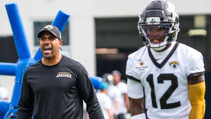 Jacksonville Jaguars defensive backs coach Anthony Perkins barks out orders as Jacksonville Jaguars wide receiver Travis Hunter (12) prepares to run a drill during the Jacksonville Jaguars’ mandatory minicamp Tuesday June 10, 2025 at the Miller Electric Center in Jacksonville, Fla. [Doug Engle/Florida Times-Union]