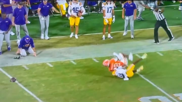 An official appeared to accidentally trip LSU head coach Brian Kelly to the ground during their win over Clemson. An official appeared to accidentally trip LSU head coach Brian Kelly to the ground during their win over Clemson.