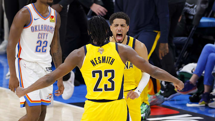 Tyrese Haliburton (0) and forward Aaron Nesmith (23) celebrate after Haliburton makes the game-winning shot during game one of the 2025 NBA Finals at Paycom Center. Mandatory Credit: Alonzo Adams-Imagn Images