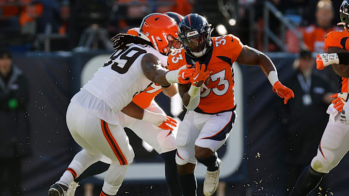 Nov 26, 2023; Denver, Colorado, USA; Denver Broncos running back Javonte Williams (33) runs