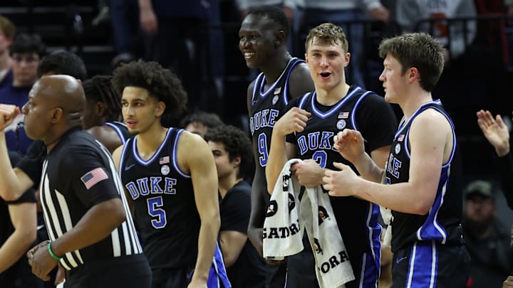 Feb 17, 2025; Charlottesville, Virginia, USA; Duke Blue Devils guard Cooper Flagg (2) celebrates with teammates in the final seconds against the Virginia Cavaliers at John Paul Jones Arena. Mandatory Credit: Geoff Burke-Imagn Images Feb 17, 2025; Charlottesville, Virginia, USA; Duke Blue Devils guard Cooper Flagg (2) celebrates with teammates in the final seconds against the Virginia Cavaliers at John Paul Jones Arena. Mandatory Credit: Geoff Burke-Imagn Images