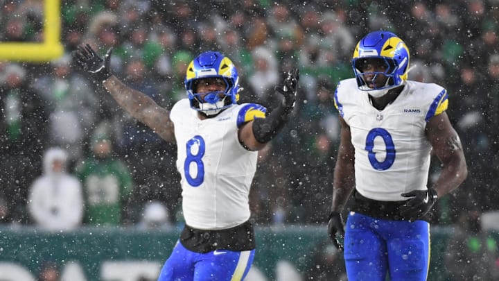 Jan 19, 2025; Philadelphia, Pennsylvania, USA; Los Angeles Rams linebacker Jared Verse (8) and linebacker Byron Young (0) celebrate a sack against the Philadelphia Eagles in a 2025 NFC divisional round game at Lincoln Financial Field. Mandatory Credit: Eric Hartline-Imagn Images