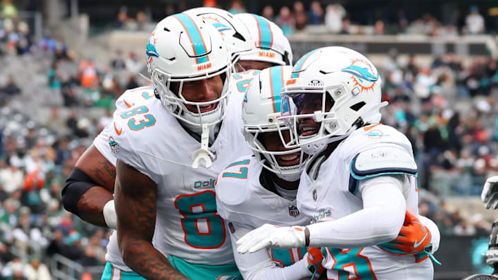 Miami Dolphins running back De'Von Achane (28) celebrates with tight end Darren Waller (83) and wide receiver Jaylen Waddle (17) after scoring a touchdown against the New York Jets during the first half at MetLife Stadium. Mandatory Credit: Ed Mulholland-Imagn Images Miami Dolphins running back De'Von Achane (28) celebrates with tight end Darren Waller (83) and wide receiver Jaylen Waddle (17) after scoring a touchdown against the New York Jets during the first half at MetLife Stadium. Mandatory Credit: Ed Mulholland-Imagn Images