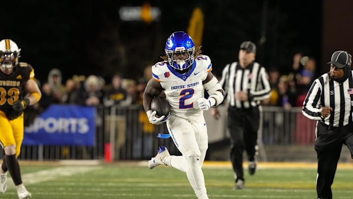 Nov 23, 2024; Laramie, Wyoming, USA; Boise State Broncos running back and Heisman Trophy candidate Ashton Jeanty (2) runs for a touchdown against the Wyoming Cowboys during the first quarter at Jonah Field at War Memorial Stadium. Mandatory Credit: Troy Babbitt-Imagn Images

