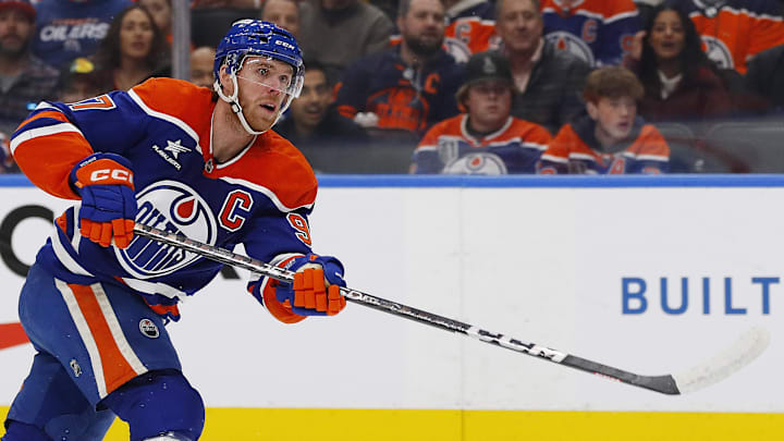 Oct 22, 2024; Edmonton, Alberta, CAN; Edmonton Oilers forward Connor McDavid (97) takes a shot against the Carolina Hurricanes at Rogers Place. Mandatory Credit: Perry Nelson-Imagn Images