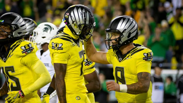 Oregon Ducks quarterback Dillon Gabriel and Oregon Ducks wide receiver Evan Stewart celebrate after a touchdown as the Ducks host the Spartans Friday, Oct. 4, 2024 at Autzen Stadium in Eugene, Ore.