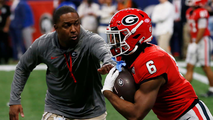 Georgia running back Kenny McIntosh (6) runs a drill with Georgia Wide Receivers Coach Bryan