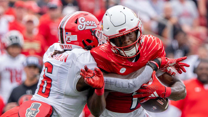 Louisville Cardinals wide receiver Ja'Corey Brooks (1) runs down the field against Austin Peay Governors linebacker Bo Spearman (6) during their game on Saturday, Aug. 31, 2024 at L&N Federal Credit Union Stadium in Louisville, Ky.