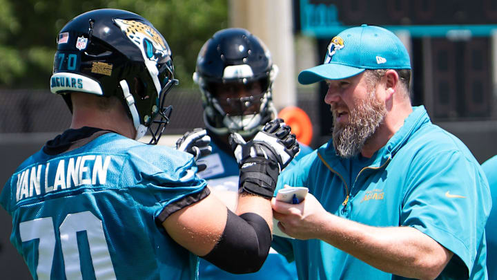 Jacksonville Jaguars Offensive Line Coach Shaun Sarrett coaches Jacksonville Jaguars offensive tackle Cole Van Lanen (70) during the fourth organized team activity at the Miller Electric Center in Jacksonville, Fla. Tuesday, May 27, 2025. [Doug Engle/Florida Times-Union]
