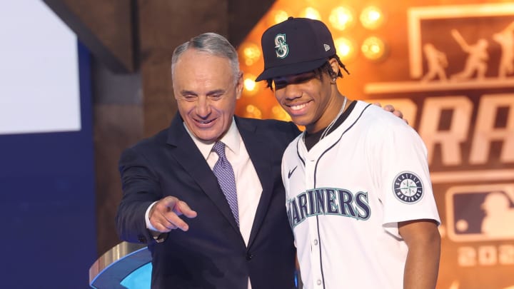 Jul 14, 2024; Ft. Worth, TX, USA;  MLB Commissioner Rob Manfred takes a photo with Jurrangelo Cijntje after being drafted by the Seattle Mariners with the 15th pick during the first round of the MLB Draft at Cowtown Coliseum. Mandatory Credit: Kevin Jairaj-USA TODAY Sports