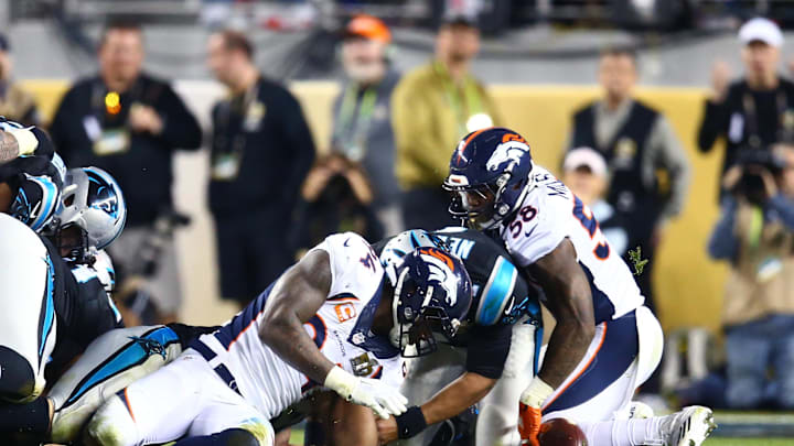 Feb 7, 2016; Santa Clara, CA, USA; Denver Broncos linebacker Von Miller (58) and  defensive end DeMarcus Ware (94) attempt to recover the fumbled ball by Carolina Panthers quarterback Cam Newton (1) in the fourth quarter of Super Bowl 50 at Levi's Stadium. Mandatory Credit: Mark J. Rebilas-Imagn Images
