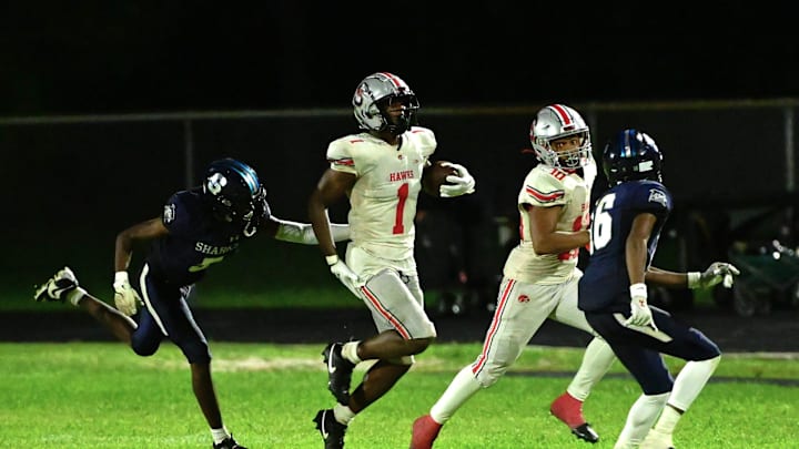 Seminole Ridge's Ty Jackson during a run in the first half against Spanish River on Aug. 30, 2024.