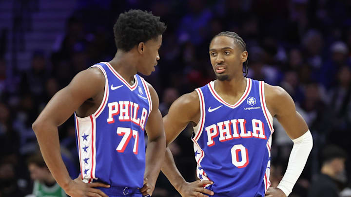 Nov 11, 2025; Philadelphia, Pennsylvania, USA; Philadelphia 76ers guard Tyrese Maxey (0) talks with guard VJ Edgecombe (77) during the third quarter against the Boston Celtics at Xfinity Mobile Arena. Mandatory Credit: Bill Streicher-Imagn Images