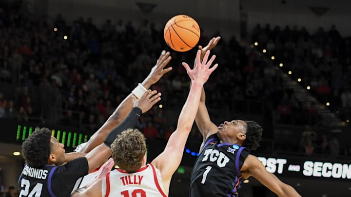 Players go for the ball Thursday, March 19, 2026, during the NCAA Men’s Basketball Tournament first round game between the Ohio State Buckeyes and the TCU Horned Frogs at Bon Secours Wellness Arena in Greenville, South Carolina.