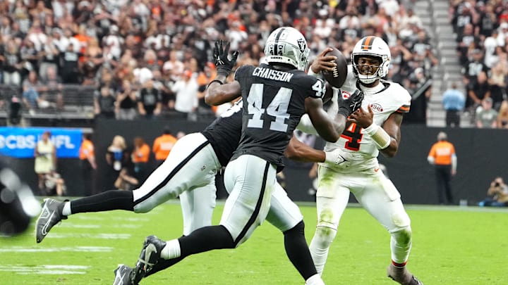 Sep 29, 2024; Paradise, Nevada, USA; Las Vegas Raiders defensive end Charles Snowden (49) and defensive end K'Lavon Chaisson (44) stop Cleveland Browns quarterback Deshaun Watson (4) in the fourth quarter at Allegiant Stadium. Mandatory Credit: Stephen R. Sylvanie-Imagn Images
