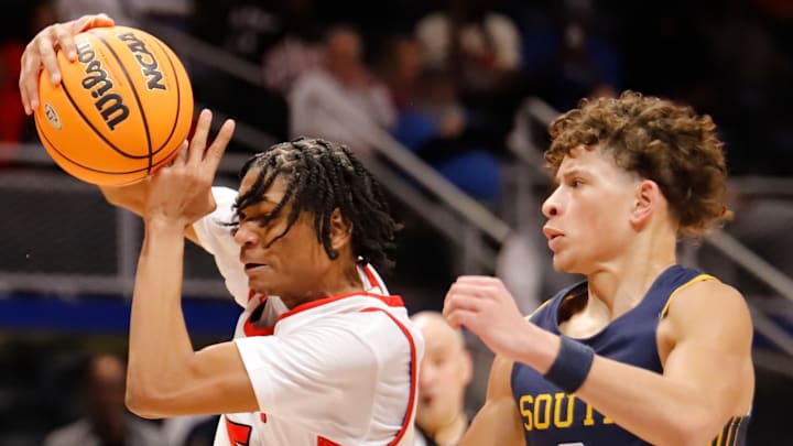 Aliquippa's Qa'lil Goode, left, attempts to maneuver to get around South Allegheny's Drew Cook Saturday at Petersen Events Center. Goode scored a team-high 30 points to help the Quips win their 15th WPIAL title with a 65-54 victory. Aliquippa's Qa'lil Goode, left, attempts to maneuver to get around South Allegheny's Drew Cook Saturday at Petersen Events Center. Goode scored a team-high 30 points to help the Quips win their 15th WPIAL title with a 65-54 victory.