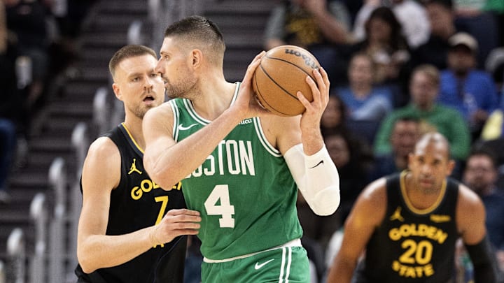 Feb 19, 2026; San Francisco, California, USA; Golden State Warriors center Kristaps Porzingis (7) guards Boston Celtics center Nikola Vucevic (4) during the third quarter at Chase Center. Mandatory Credit: D. Ross Cameron-Imagn Images