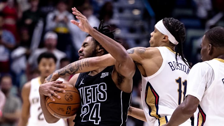 Nov 11, 2024; New Orleans, Louisiana, USA;  New Orleans Pelicans guard Brandon Boston Jr. (11) fouls Brooklyn Nets guard Cam Thomas (24) during the second half at Smoothie King Center. Mandatory Credit: Stephen Lew-Imagn Images