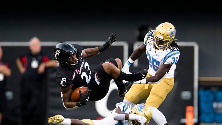 UCLA Bruins defensive back Elijah Gates (12) tackles Cincinnati Bearcats running back Gerrid Doaks (23) in the first half of the NCAA football game between Cincinnati Bearcats and UCLA Bruins on Thursday, Aug. 29, 2019, at Nippert Stadium in Cincinnati.
Cincinnati Bearcats Ucla Bruins UCLA Bruins defensive back Elijah Gates (12) tackles Cincinnati Bearcats running back Gerrid Doaks (23) in the first half of the NCAA football game between Cincinnati Bearcats and UCLA Bruins on Thursday, Aug. 29, 2019, at Nippert Stadium in Cincinnati.
Cincinnati Bearcats Ucla Bruins