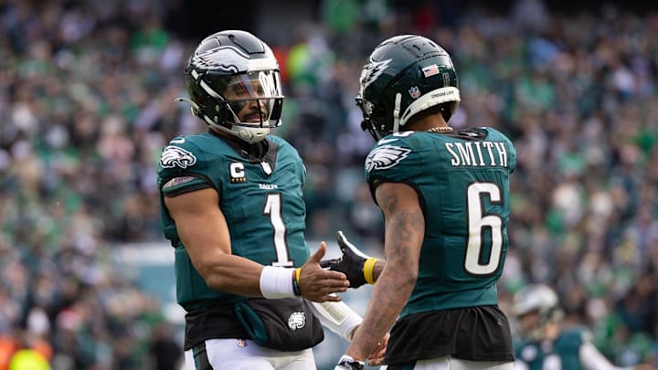 Dec 8, 2024; Philadelphia, Pennsylvania, USA; Philadelphia Eagles wide receiver DeVonta Smith (6) and quarterback Jalen Hurts (1) celebrate their touchdown connection against the Carolina Panthers during the second quarter at Lincoln Financial Field. Mandatory Credit: Bill Streicher-Imagn Images Dec 8, 2024; Philadelphia, Pennsylvania, USA; Philadelphia Eagles wide receiver DeVonta Smith (6) and quarterback Jalen Hurts (1) celebrate their touchdown connection against the Carolina Panthers during the second quarter at Lincoln Financial Field. Mandatory Credit: Bill Streicher-Imagn Images